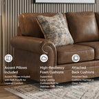 Signature Design by Ashley Shadsburne Rustic Faux Leather Sofa with Nailhead Trim and 2 Throw Pillows, Brown